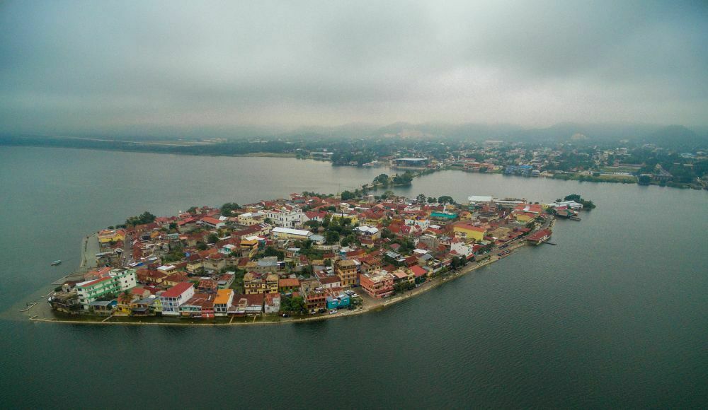 Aerial View of Flores Island Guatemala, one of the most beautiful places to visit in Guatemala, surrounded by Lake Peten Itza