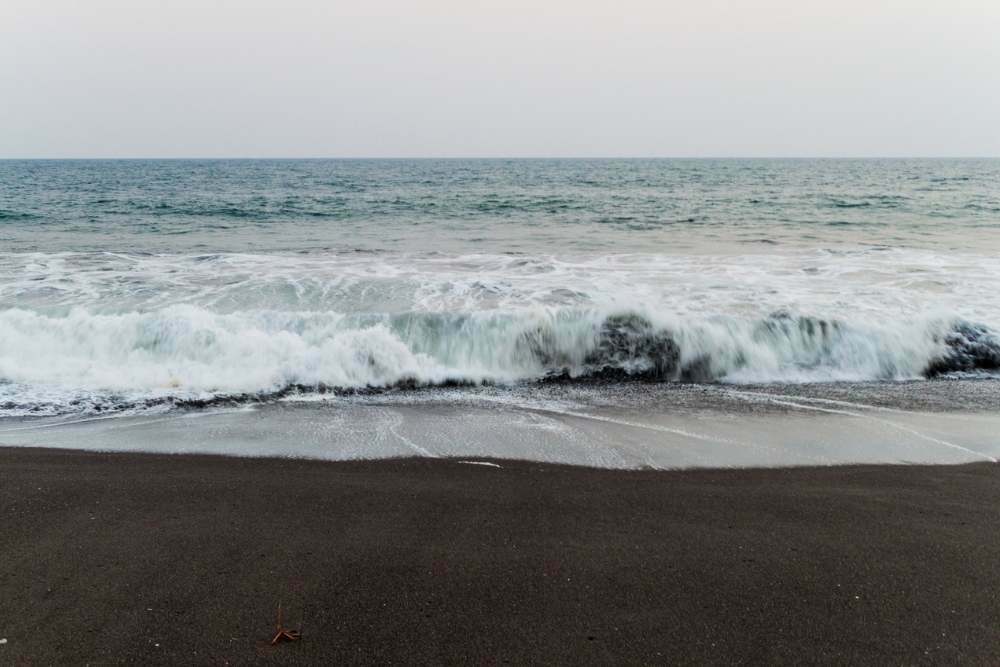 Volcanic Black Sand Beach in Monterrico Guatemala Beautiful Place to Visit with the Waves Crashing Against the Shore