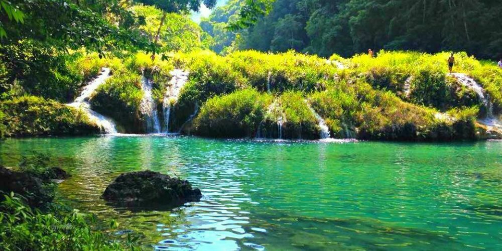 Semuc Champey Waterfalls in Guatemala flowing into a turquoise pool